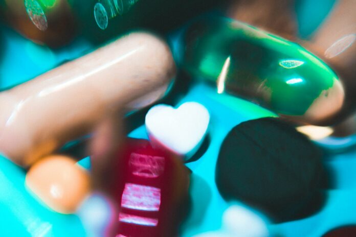 Photo by Nastya Dulhiier a close up of pills and pills bottles