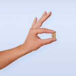 “작지만 큰 변화, 일상에서 실천하는 영양과 보충제 활용법” A person's hand with a ring on it