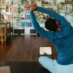 여성 건강관리, 균형 잡힌 생활 습관이 핵심 a man doing yoga in a living room
