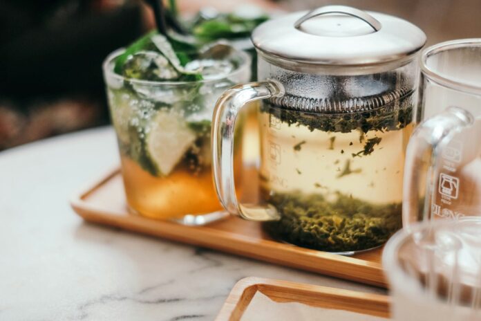 Photo by Massimo Rinaldi clear glass mug on tray