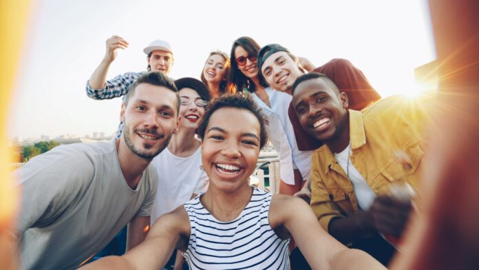 Photo by Vitaly Gariev Diverse group of friends taking a selfie outdoors selfie
