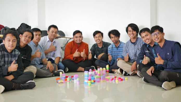 Photo by Herlambang Tinasih Gusti a group of men sitting next to each other